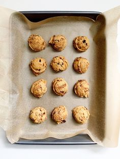 twelve cookies are on a baking sheet ready to be baked in the oven and eaten