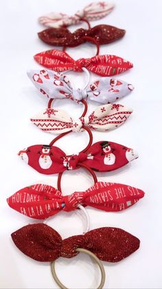 STYLE  Festive Christmas bow bobbles in a range of traditional and fun prints perfect for the holiday season and for matching to Christmas outfits and party wear. Sold individually. Perfect for ponytails or to purchase in pairs for pigtails and plaits! A few of them are in a large size which make a perfect statement pony tail. These are handmade by myself and come with a coordinating colour bobble. Please note the print placement may differ from the photos.  SIZE: These bow hair ties are the per Christmas Gift Hair Accessories With Matching Headband, Adjustable Hair Accessories For Christmas Gifts, Adjustable Hair Accessories With Matching Headband For Festive Occasions, Adjustable Hair Accessories With Matching Headband For Festivities, Playful Bow Hair Accessories For Gift, Playful Bow Headband For Gift, Adjustable Red Bow Hair Accessories For Gift, Adjustable Red Bow Hair Accessory Gift, Playful Satin Bow For Gifts