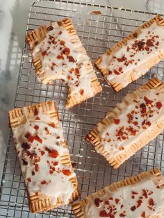 four desserts are cooling on a wire rack