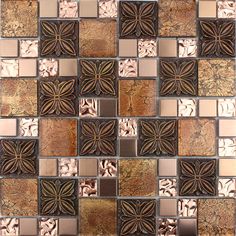 a mosaic tile wall with brown and white tiles on the bottom, in different colors