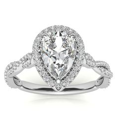 a pear shaped diamond engagement ring with twisted shans on the band and an oval center stone