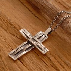 Custom handcrafted in the finest detail, this handmade sterling silver men's cross necklace is a flawless accessory that is stunning when worn. Suspended from a sterling silver chain or a black leather cord, the cross pendant combines the beauty of both polished and oxidized sterling silver in a compelling display of design. Scrupulous attention to detail is what makes this cross necklace unique and endearing. Gift it to that special man in your life as a riveting symbol of his faith. Cross meas Silver Cross Pendant Necklace With Sterling Silver Clasp, Silver Cross Necklace With Sterling Clasp, Silver Cross Necklace With Sterling Silver Clasp, Silver Crucifix Necklace With Polished Finish, Sterling Silver Cross Pendant Necklace With Polished Finish, Sterling Silver Necklace With Cross Pendant And Polished Finish, Polished White Gold Sterling Silver Cross Necklace, Engraved Sterling Silver Cross Necklace, Spiritual Silver Cross Necklace With Oxidized Finish