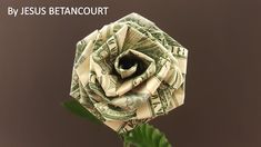 an origami rose made out of one dollar bill is featured in this ad