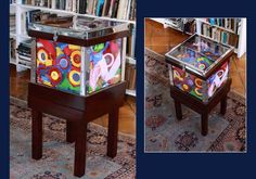 a table that has some kind of colorful object on it in front of a book shelf