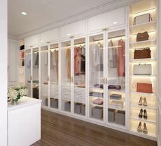 a white closet filled with lots of shoes and bags