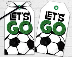 two tags with soccer balls on them and the words let's go written in green