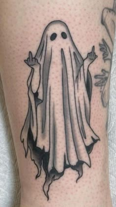 a black and white tattoo of a ghost