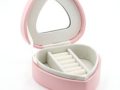 an open pink jewelry box on a white surface