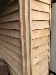 the side of a house with wood siding