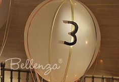 a large balloon with the number three on it