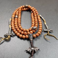 ❤This bodhi beads mala is made by Tibetan craftsmen and come from Hepo Town, Baiyu County, the birthplace of the famous Tibetan handicrafts,about 30 years old, hold and blessed by a lama in Baiyu Monastery.It is composed of 108 bodhi seed beads, and is equipped with 3 cold iron dzi beads, cold iron bead counters are installed on both sides, 1 mani jewel bead clip,and finally consists a skull guru bead and vajra on the end, very elegant.❤Details1. Handmade 108 bodhi beads approximately 8-9mm,mala Spiritual Brown Beaded Bracelets, Spiritual Brown Beaded Bracelets For Rituals, Handmade Brown Beaded Bracelets For Ceremonial Use, Handmade Brown Beaded Bracelets For Rituals, Handmade Spiritual Mala For Rituals, Spiritual Healing Brown Beads, Traditional Brown Beaded Bracelets For Rituals, Brown Spiritual Beads For Meditation, Hand-strung Brown Mala For Healing