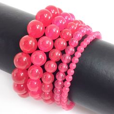 ✦Gemstone: Jade ✦Color: Hot Pink ✦Shape: Smooth Round Beads ✦Size: 4mm, 6mm, 8mm, 10mm, 12mm ✦Average Strand Weight: < 4oz ✦QTY: 1 pc / package ♕Beautiful & High Quality Bracelet♕  Our bracelet length 7.5", fit with a 6.75" wrist, it is our standard size. We offer to resize bracelet 5"-8" to fit your wrist! If you like the different bracelet lengths, please let us know your wrist size. We are happy to take care of it for you. You can see our Personalization Option. Thank you! MEASURE YOUR WRIST:    - Measure around at the wrist bone in tape or even a strip of paper.   - Choose a place where you would normally wear a bracelet.  Make it as loose or snug.   - To use the strip of paper, mark where the end of the bracelet needs to be and then measure the paper with a ruler.   - Increase the wri Beaded Bracelet For Men, Pink Jade, Wire Jewelry Designs, Jade Bracelet, Bracelet For Men, Coral Beads, Mens Jewelry Bracelet, Gemstone Healing, Bracelet Sizes