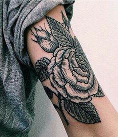 two pictures of a woman's arm with flowers and leaves tattooed on the arm