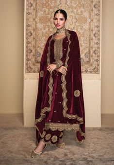 Shop our luxurious Pakistani velvet suit for weddings, featuring a heavily embroidered neck, daman, sleeves, and cutwork detailing on pure velvet. The set includes a full-width dupatta with intricate embroidery and a solid velvet bottom, making it perfect for any grand occasion. Elevate your wedding look with this stunning velvet ensemble. 🛠️ Custom stitching available! Complete your wedding ensemble with this luxurious velvet suit and make heads turn at your special event. 🌟 Pure velvet fabri Pakistani Velvet Suits, Zainab Chottani, Pakistani Designer Clothes, Asim Jofa, Velvet Dress Designs, Pakistani Fancy Dresses, Velvet Suit, Velvet Collection, Pakistani Designers