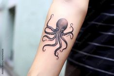 an octopus tattoo on the arm