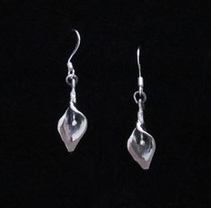 The Calla Lily is an ancient flower that is often representative of purity and fertility. The earring is 20mm long not including the ear wire. Etsy Earrings Dangle, Calla Lily, Ear Wire, Fertility, Jewelry Earrings Dangle, Dangle Drop Earrings, Dangle Earrings, Lily, Jewelry Earrings