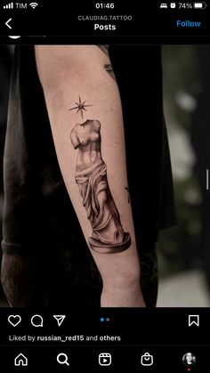 a man's arm with a statue tattoo on the left side of his arm