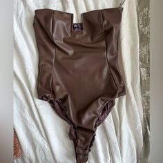 Never Worn Brown Leather Snap Bodysuit. Size Xs Spring Party Brown Bodysuit, Trendy Brown Bodysuit For Night Out, Chic Faux Leather Party Bodysuit, Chic Brown Fitted Bodysuit, Trendy Fitted Brown Bodysuit, Fitted Brown Summer Bodysuit, Casual Brown Fitted Bodysuit, Brown Bodysuit Short Sleeve, Light Pink Bodysuit