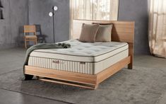 a bed sitting on top of a wooden frame