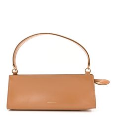 This is an authentic MANSUR GAVRIEL Calfskin Pencil Shoulder Bag in Caramel. This bag is crafted of calfskin leather in tan. It features a matching leather top handle with brass links and a rear pocket. The top zipper opens to a beige leather interior. Mansur Gavriel, Leather Interior, Leather Top, Calf Skin, Caramel, Pencil, Zipper, Handbags, Shoulder Bag