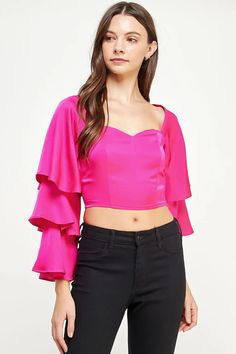 Trumpet sleeve top in stretch satin fabric. This crop top features a sweetheart neckline and long tiered trumpet sleeves. For a comfortable and flattering fit, smocking adorns the back, paired with a high back tie. The playful and flowy sleeves will make any outfit stand out! Questions about fit? Email Support@LillaCavallo.com for additional help with choosing the perfect size for you! Flirty Fitted Ruffle Crop Top, Flirty Fitted Ruffles Crop Top, Flirty Fitted Crop Top With Ruffles, Glamorous Fitted Satin Tops, Fitted Satin Top For Glamorous Style, Fitted Ruffle Square Neck Crop Top, Fitted Square Neck Crop Top With Ruffles, Fitted Off-shoulder Top With Elastic Sleeves, Party Crop Top With Blouson Long Sleeves