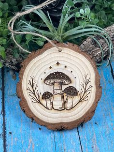 a piece of wood that has some mushrooms on it and plants growing out of it