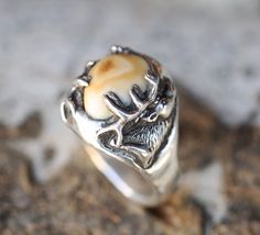 Introducing our new line of Elk Tooth (elk ivory) "Lost Wax Casting" rings! This design features the carving of an elk but could feature anything you request! Additional wood and inlay options available upon request. Each ring is hand-carved by our in-house artist Kevin Fredrickson, and set using an ethically collected elk tooth. Available in: SILVER & 10K GOLD We love taking on custom orders. If you have your own idea for a design reach out to us in the contact section of the website, we want to make something as unique and special as the love you have found. ADD A CUSTOM ENGRAVING TO YOUR RING BOX HERE! Wax Casting Rings, Lost Wax Casting Rings, Elk Ivory Ring, Elk Ivory Jewelry, Elk Ivory, Antler Wedding Rings, Antler Wedding Band, Tooth Ring, Ivory Ring