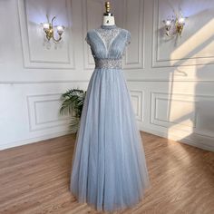 Majestic Mist: 2024 Grey High-Neck A-Line Beaded Long Evening Gown Gray Floor-length Gown For Banquet, Gray Floor-length Prom Season Gown, Gray Floor-length Gown For Prom Season, Gray Floor-length Prom Evening Dress, Embellished Gray Evening Dress For Wedding, Gray Floor-length Evening Dress For Prom, Gray Sequined Wedding Evening Dress, Gray Embellished Evening Dress For Gala, Embellished Gray Evening Dress For Gala