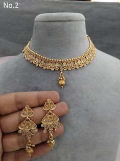 *Light Weight Gold Adjustable necklace set with earrings and tikka. *Studded with crystal stone. *No.1 *Necklace width- 0.6 inches *Earrings length-  2.5 inches (Included drops) *No.2 *Necklace width- 0.6 inches *Earrings length-  2 inches (Included drops) *Earrings width- 0.9 inches *No.3 *Necklace width- 0.7 inches *Earrings length-  1.6 inches (Included drops) *No.4 *Necklace width- 0.7 inches *Earrings length-  1.5 inches (Included drops) *Earrings width- 1.4 inches *No.5 *Necklace width- 0. 4 Necklace, 2 Necklace, Bollywood Style, Polki Jewellery, Jewellery Necklace, Adjustable Necklace, Crystal Stone, Bollywood Fashion, Indian Bridal