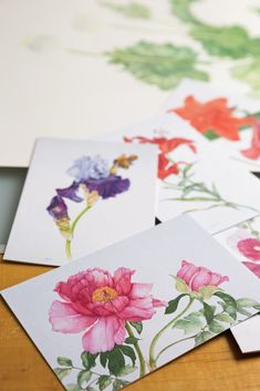 six flower cards laid out on a table