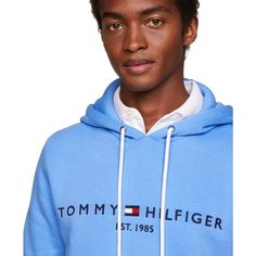 Stay comfortable and stylish with Tommy Hilfiger's Embroidered Logo Hoodie. Made with cotton, this fleece hoodie is designed for total comfort. Featuring the iconic Hilfiger signature logo and a convenient kangaroo pocket, this hoodie is the perfect addition to your wardrobe..Regular Fit: Tommy Hilfiger's Classic Pullover Hoodie made to fit comfortably..Size Medium Chest measures 44-1/2'.Model is wearing a size Medium.Drawstring hoodie for adjustable hood.Kangaroo pocket for added convenience.Cl Logo Cotton Hoodie For Fall, Fall Fleece Hoodie With Logo Detail, Fall Cotton Logo Hoodie, Fall Cotton Hoodie With Logo, Hooded Logo Sweatshirt For Fall, Logo Hooded Sweatshirt For Fall, Casual Logo Hoodie For Winter, Winter Fleece Hoodie With Logo Detail, Hooded Fall Logo Hoodie