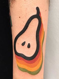 a person with a tattoo on their arm that has a pear and rainbow colors around it