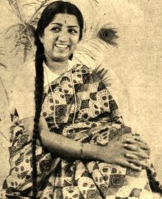 an old photo of a woman with long hair