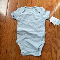 New With Tags! Excellent Condition. Light Baby Blue. Cute Blue Short Sleeve Bodysuit For Summer, Blue Fitted Cotton Short Sleeve Bodysuit, Casual Blue Onesie For Playtime, Blue Casual Short Sleeve Bodysuit For Summer, Casual Blue Short Sleeve Bodysuit For Summer, Cute Light Blue Onesie For Playtime, Solid Color Short Sleeve Onesie For Playwear, Solid Color Short Sleeve Bodysuit For Playtime, Solid Short Sleeve Bodysuit For Playtime