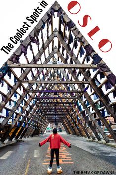 a man standing in the middle of a wooden structure