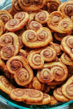 cinnamon buns in a glass bowl on a table