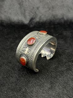 Beautiful Rare Vintage Handicraft Afghani Silver Bangle With Carnelian Stone From Afghanistan. Unique Bangle For Collection. Shipping Payment Feedback & Return Policy 1 : We ship Monday to Friday Via Airmail Register Insured  With Tracking # takes 2 to 4 Weeks to Destination. 2 : Contact us if you did not receive your item after 4 weeks. 3 : We Accept Payment From Most of the Mainstream Payment Methods. 4 : In Any Inconvenience Case we do Accept Return and full Refund. 5 : We Ship worldwide via Bohemian Carnelian Bracelet, Traditional Cuff Bracelet With Natural Stones For Gift, Traditional Cuff Bracelet Bangle With Natural Stones, Traditional Adjustable Cuff Bracelet With Natural Stones, Vintage Carnelian Bracelets As Gift, Vintage Carnelian Bracelets Gift, Vintage Carnelian Bracelet Gift, Unique Bangle, After 4