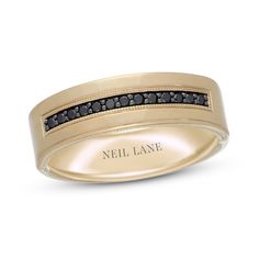 This sleek men's wedding band from Neil Lane® collection features a striking line of round black diamonds framed in milgrain detailing. Crafted of 14K yellow gold, the band has a total diamond weight of 1/6 carat. Black diamonds are treated to permanently create the intense black color. Gold Wedding Bands For Men, Black Diamond Wedding Band, Personalized Engagement Rings, Mens Wedding Bands Black, Black Diamond Wedding Bands, Neil Lane Engagement Rings, Neil Lane, Men Rings, Diamond Wedding Rings Sets