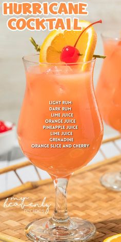 two glasses filled with orange juice and garnished with cherries on the rim