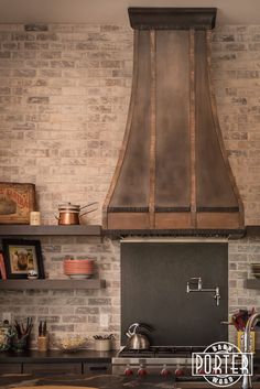 a stove top oven sitting inside of a kitchen next to a wall covered in shelves