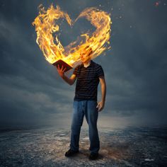 a man holding a book in his hands with the words, the love of god on it