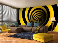 a modern living room with yellow and black decor on the wall, large window blinds