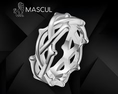 These striking thorn-shaped rings from Mascul embody a fierce Gothic aesthetic, perfect for those drawn to dark, edgy fashion.  Available in deep black, regal gold, and polished silver, each ring features a twisted design of interlocking thorns, evoking imagery of medieval crowns and ancient symbolism.  The black variant radiates a dark, mysterious allure, while the gold adds a bold, opulent edge, and the silver offers a sleek, metallic contrast.  Ideal for those with a taste for Gothic fashion, Medieval Crowns, Medieval Crown, Gothic Mode, Dark Mysterious, Gothic Aesthetic, Rose Ring, Perfect Gift For Her, Edgy Fashion, Gothic Fashion