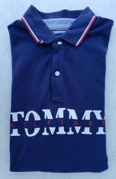 Brand: Tommy Hilfiger Type: Polo Shirt Size: Men's Large Fit: Custom Fit Closure: 1/4 Zip with Collar Sleeves: Short Sleeves Material: 100% Cotton Condition: Excellent Condition. Very lightly used. No rips, holes or stains. Please see all the pictures as they are part of the description.  Message me with any questions. Collared Cotton T-shirt With Logo Print, Cotton Collared Top With Logo Print, Collared Cotton Shirt With Logo Print, Collared Cotton Shirt With Logo, Cotton Collared Shirt With Logo Print, Cotton Polo Collar Shirt With Logo Print, Collared Cotton Tops With Letter Print, Collared Tops With Logo Print For Summer, Summer Collared Tops With Logo Print