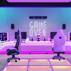 an office with neon lights and chairs in front of the computer desk that says game over