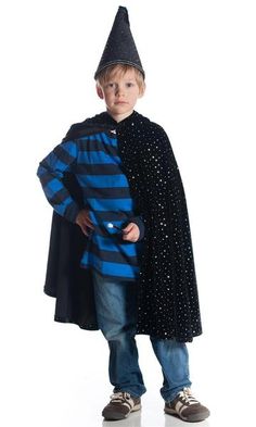 a young boy dressed up as a wizard with a black hat and blue striped coat