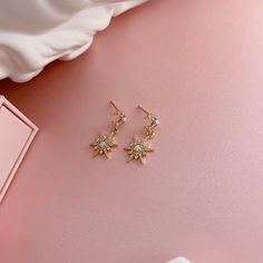 * DETAILS * - 14K Tiny Pearl Moon Post Earring 5.5 mm X 6 mm - 14K Gold Plated on brass Opal Star Charms ✨You may also like the matching necklace. https://www.etsy.com/JinnysJewelryBySeJin/listing/1348774327/opal-star-huggie-earrings-dainty-charm?utm_source=Copy&utm_medium=ListingManager&utm_campaign=Share&utm_term=so.lmsm&share_time=1669059838239 ✨More earrings and necklaces. www.Etsy.com/shop/JinnysJewelryBySeJin ------------------------------------------ * CARE TIPS * ⭐️TO PREVENT TARNISH: Ke Celestial Gold Drop Earrings, Gold Celestial Drop Earrings, 14k Gold-filled Star Earrings, Gold Celestial Round Earrings, Star-shaped 14k Gold-filled Earrings, Celestial Gold Round Earrings, Gold Star Earrings Tarnish Resistant, Gold Star-shaped Tarnish Resistant Earrings, Celestial 14k Gold Filled Earrings