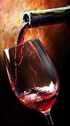 red wine being poured into a glass with an animal head sticking out of the top