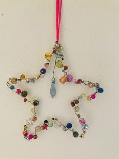 Wire Beaded Hanging Star Made from a collection of recycled beads from unwanted jewellery. measures 13 cm x 14 cm Metal Wire Crafts, Beaded Wire Art, Wire Star, Beach Christmas Decorations, Recycled Beads, Hanging Stars, Sixteenth Birthday, Beach Christmas, Wire Sculpture