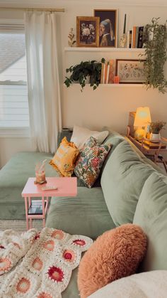 a living room filled with lots of furniture and pillows on top of it's couches